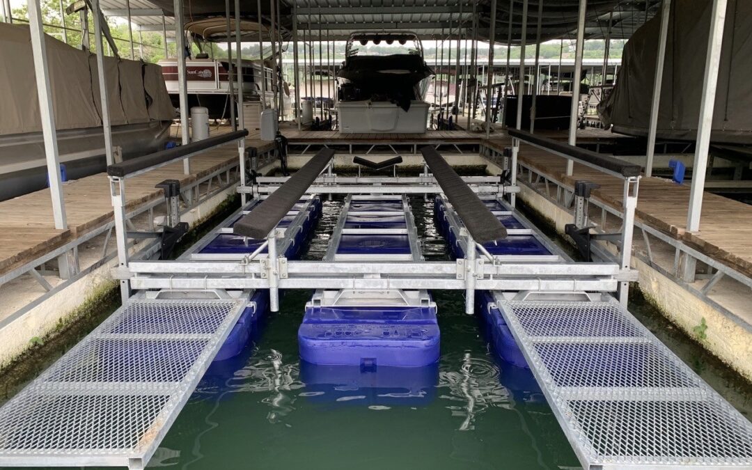 Boat lift service platforms installed on a 9800# v-hull boat lift in an outdoor boat slip